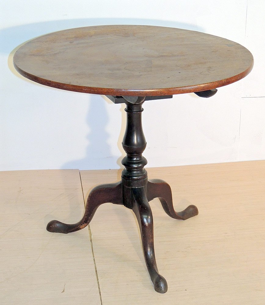 18th Century Mahogany Tea Table: 18th century mahogany tea table. Dish tilting top over birdcage support, turned shaft, and snake feet. 28-1/2" tall x 31-1/2" diameter. Provenance: From the Estate of Albert M. and Barbara Greenfield,