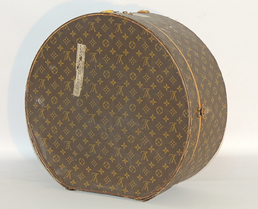 Louis Vuitton Monogramed Hat Box: Louis Vuitton monogrammed hat box. 8" tall x 19" x 20". Provenance: From the Estate of Albert M. and Barbara Greenfield, Philadelphia and Glenmoore, PA.