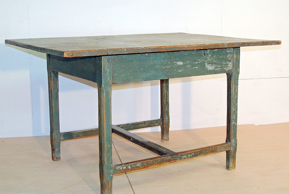 Pennsylvania Painted Pine Tavern Table: Pennsylvania painted pine tavern table. 19th century. Overhang rectangular top over base. Shaped square legs and stretcher base. Retaining a green paint surface. 25-1/2" tall x 43"1/2" long x 33-1/2"