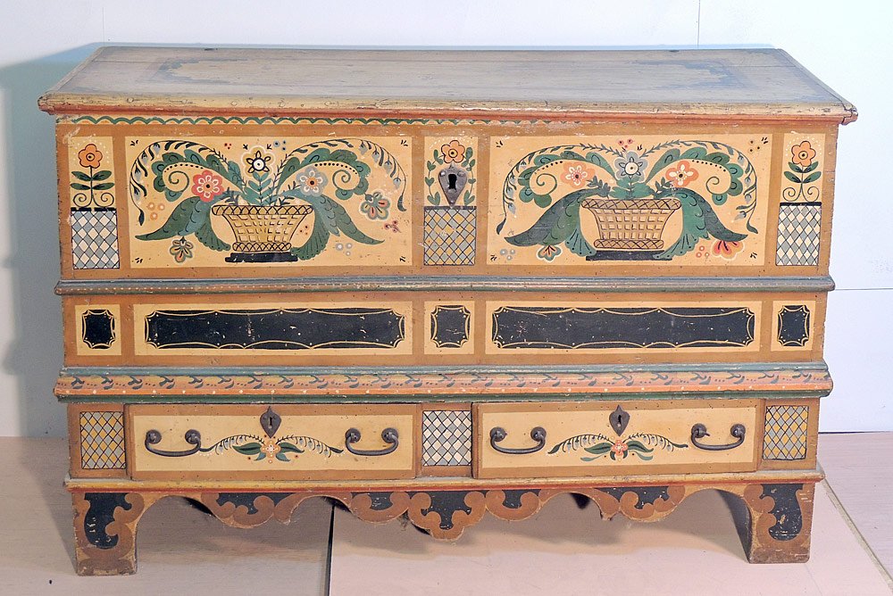 Continental Painted Dower Chest: With hinged top, 2 drawers on bracket feet, and scalloped skirt. Overall colorful floral basket painted decoration. 34 in. tall, 53-1/2 in. wide, 23-3/4 in. deep.