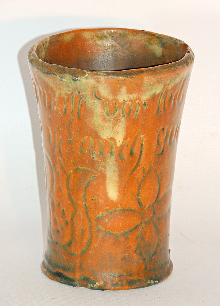 Pennsylvania Redware Cup: Pennsylvania redware cup. Dated 1793. With incised tulip decoration and script. 5" tall x 3-1/2" diameter.