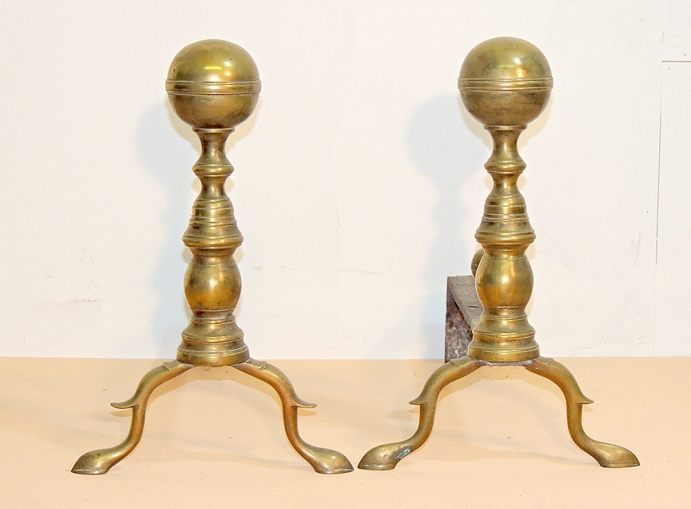 American Brass Andirons: American brass ball andirons. 19th century. With banded ball log stops. 15" tall x 10" wide.