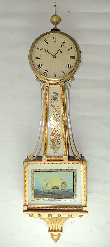 Federal Banjo Clock with Ship Panel: Federal banjo clock in mahogany case with reverse-painted glass panel with ship decoration. 41 x 10 in.