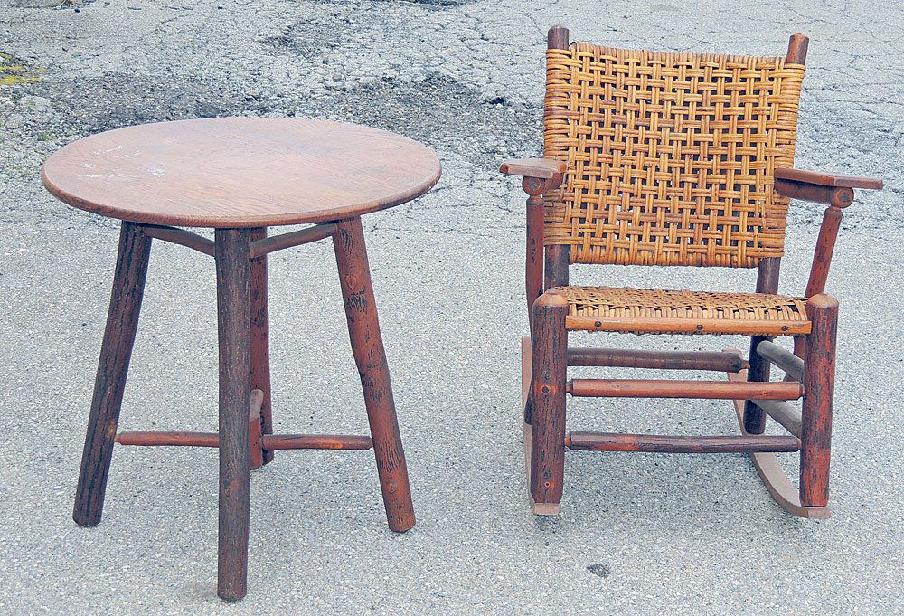 Old Hickory Rocking Chair and End Table: Old Hickory adirondack twig-form rocking chair and end table. Rocking chair has woven seat. Both pieces re-marked. Table 28 in., 28 in. diameter.