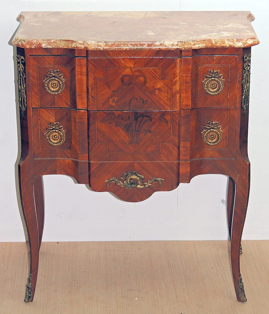 Italian Marquetry Commode: Italian marquetry commode with marble top over a two-drawer case with marquetry inlay and ormolu mounts. Drawers lined. Cabinet maker tag on case. 32 x 28-1/2 x 15 in.