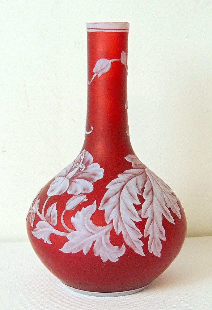 Cameo Glass Vase: Cameo glass vase, in the manner of Thomas Webb. Bottle form with foliate decoration. Some illegible markings on the base. 7 in.