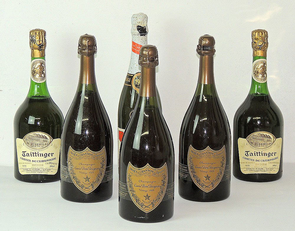Estate Champagne Collection: Estate champagne collection: Three bottles of 1969 Dom Pérignon; Two bottles of 1970 Taittinger; One 1966 G.H. Mumms. Champagne is from a local estate.