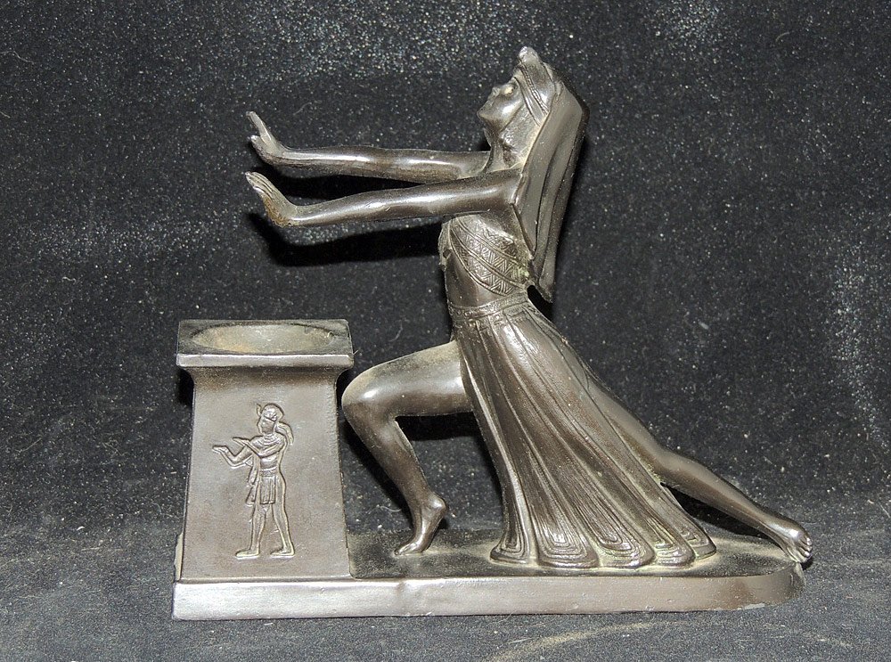 L.V. Aronson Egyptian-Design Incense Burner: L.V. Aronson incense burner depicting an Egyptian priestess praying over a burner. Marked on base "L.V. Aronson 1924". H: 6in. W: 7-1/4in.