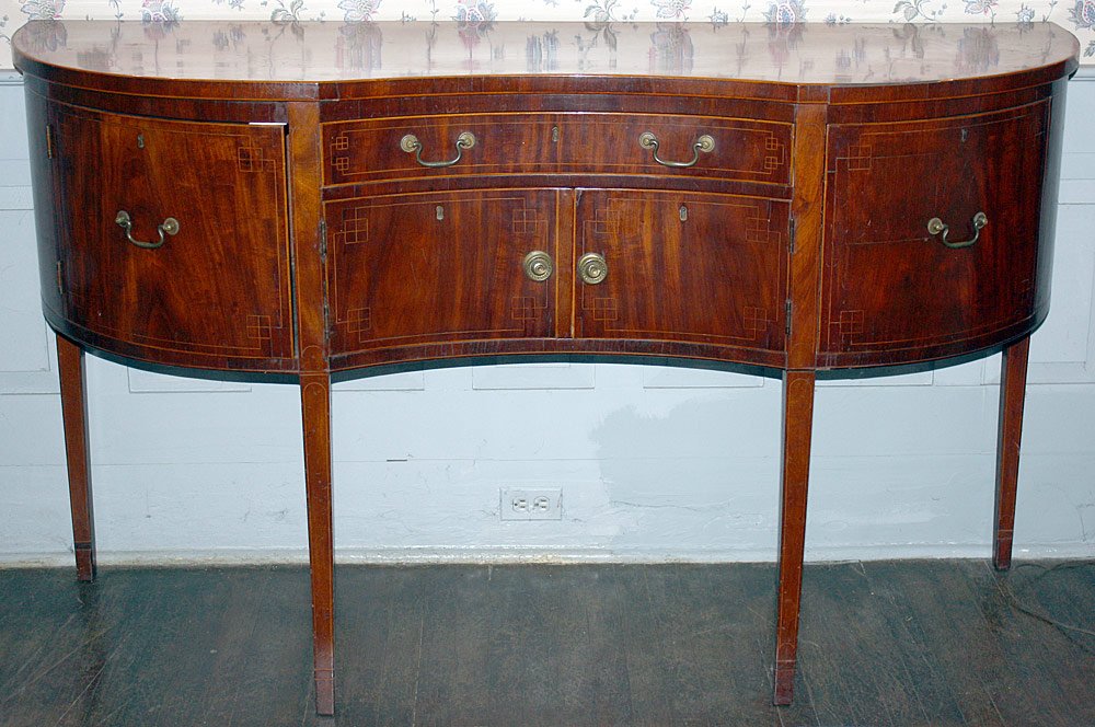 Federal Inlaid Mahogany Sideboard: Late 18th C. Philadelphia Federal inlaid mahogany sideboard with a serpentine case with line and box inlay on tapering, square legs. H: 40 in. W: 69 in. D: 23 in.