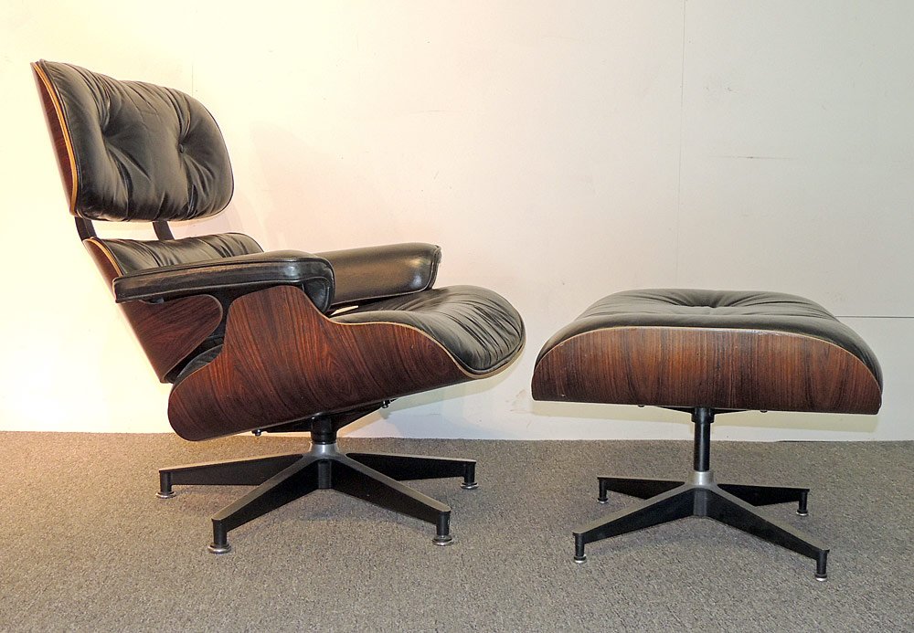 Charles and Ray Eames Lounge Chair and Ottoman: Charles and Ray Eames Rosewood lounge chair (No. 670) and ottoman (No. 671) with black leather upholstery. Herman Miller tags on both pieces. H: 33. W 33. D 33 in.
