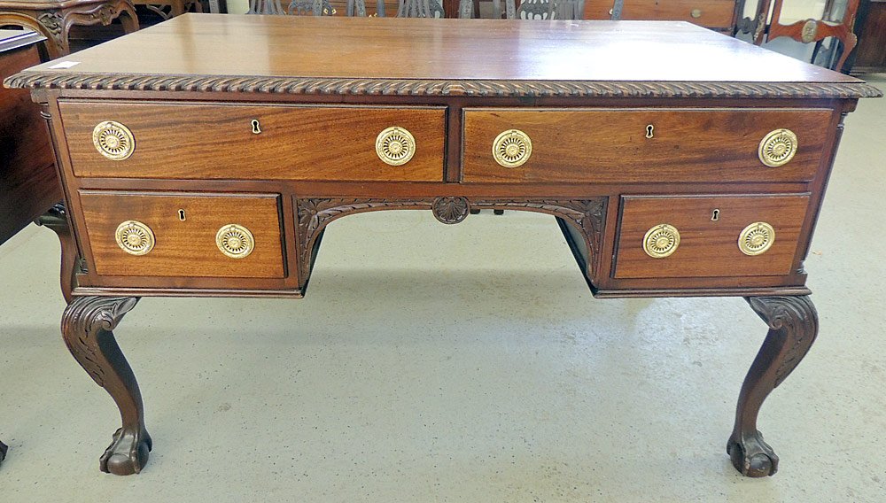 Centennial Mahogany Partner's Desk: Centennial mahogany partner's desk on ball and claw feet with rope-carved edge, and four drawers on each side. H 30-1/2. W 50. D 29-1/2 in.
