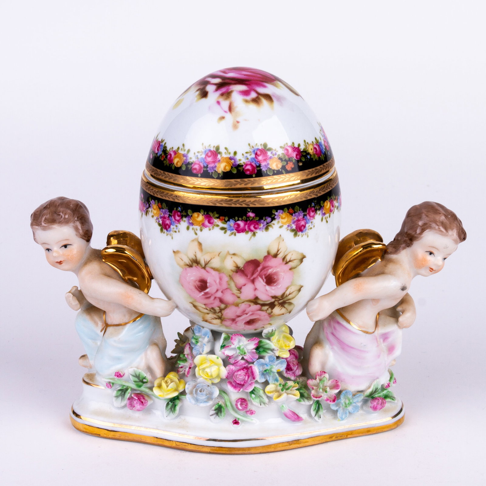 Fine Porcelain Putti Egg Trinket Box: DIMENSIONS APPROX 17X17X9CM.
