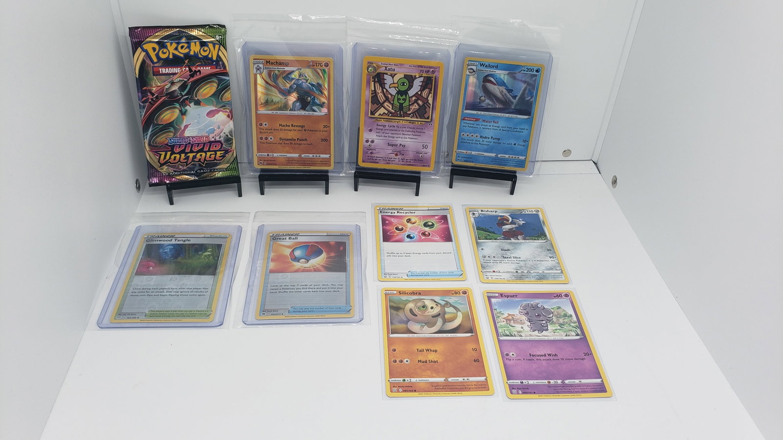 (10) TCG Pokemon Vivid Voltage pack, Holo's, Vintage: * 9 various pokemon cards from various sets and years * Add to your playing decks or complete your master sets. * Vivid Voltage pack* Machamp Holo* Wailord Holo* Xatu Neo Discovery * Reverse Holo's of
