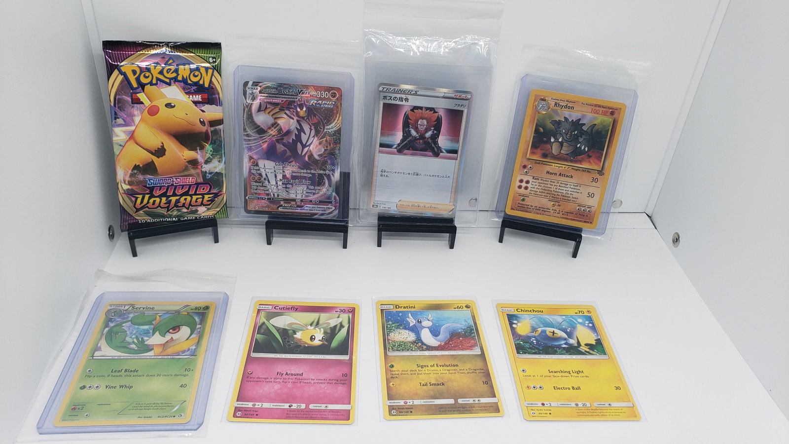 (8) TCG Pokemon Vivid Voltage pack, Vmax, Japanese, Vintage: * 7 various pokemon cards from various sets and years * Add to your playing decks or complete your master sets. * Vivid Voltage pack * Urshifu Vmax * Boss Orders Holo Japanese * Rhydon Jungle Vintage 