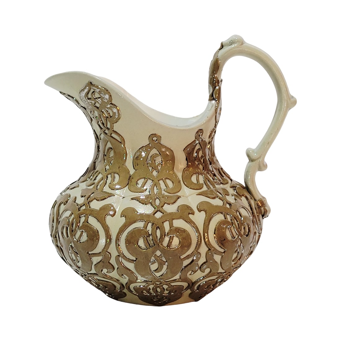 Mettlach #264, German Creamer, Early Ware Creamer: 5 1/4" Tall by 4 1/2" Wide stoneware in glazed relief with platinum accents, circa 1850's