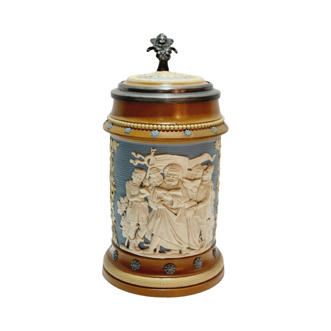 Mettlach #202, German Beer Stein, Singers: 1/2 Liter pottery in relief with pottery relief inlay lid, design attributted to Ludwig Foltz II, Text - In the breast of German men there exists the urge to sing, therefore may their praise sound lou