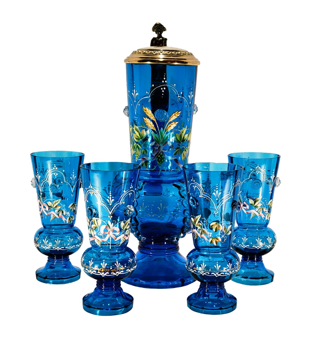Bohemian Stein Set, German Beer Stein Set, Presentation Stein with 4 Footed Glasses: 14" Tall by 6" Wide, probably 1.5 Liters with 4 glasses of hand blown translucent blue glass with faceted cylindrical neck opening to a bulbous body with clear glass prunts added to each piece underne