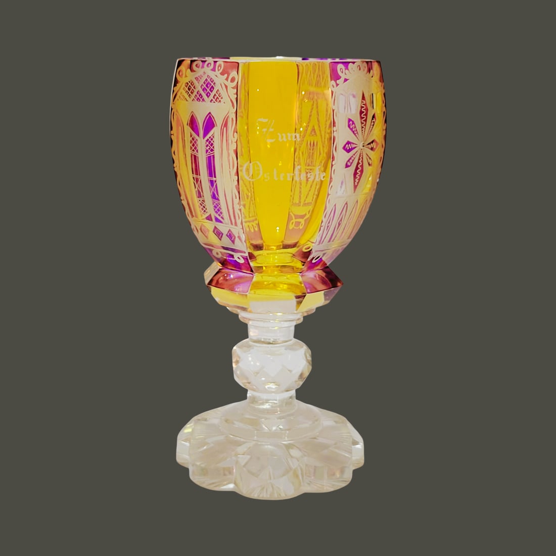 Frederich Egermann Wine Glass, Bohemian Wine Glass, Easter Memorial Glass for J.G. and J. Hamm: 6 3/4" Tall by 3 1/4" Wide blown colorless glass with bubbles and impurities, 8 facets with alternating amber and purple staining with very fine engraving, bowl connected to applied multi ribbed stem 