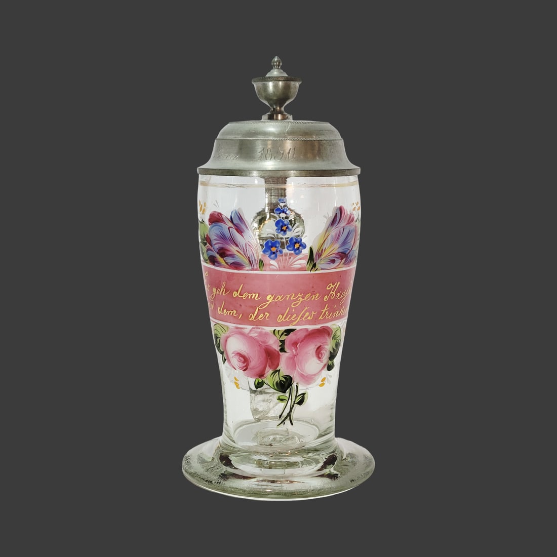 Biedermeier Pedestal Stein, Bohemian Beer Stein, Enameled Stein with Saying: 0.7 Liter blown colorless glass with bubbles and impurities, hand enameled florals and reverse enameling as well on tapered body with flared base, has nice pontil, Text - Good health to the whole hous
