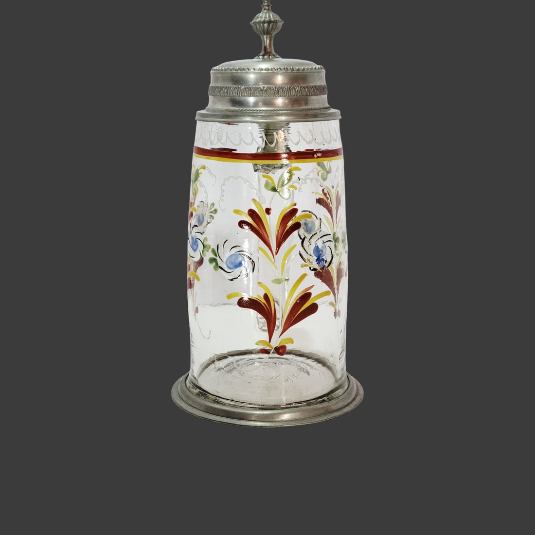 Biedermeier Conical Stein, Bohemian Beer Stein, Floral Stein: 0.75 Liter blown colorless glass with bubbles and impurities, hand enameled horizontal top border consisting of white scalloping and red and yellow lines, hand enameled flowers throughout the body, fl