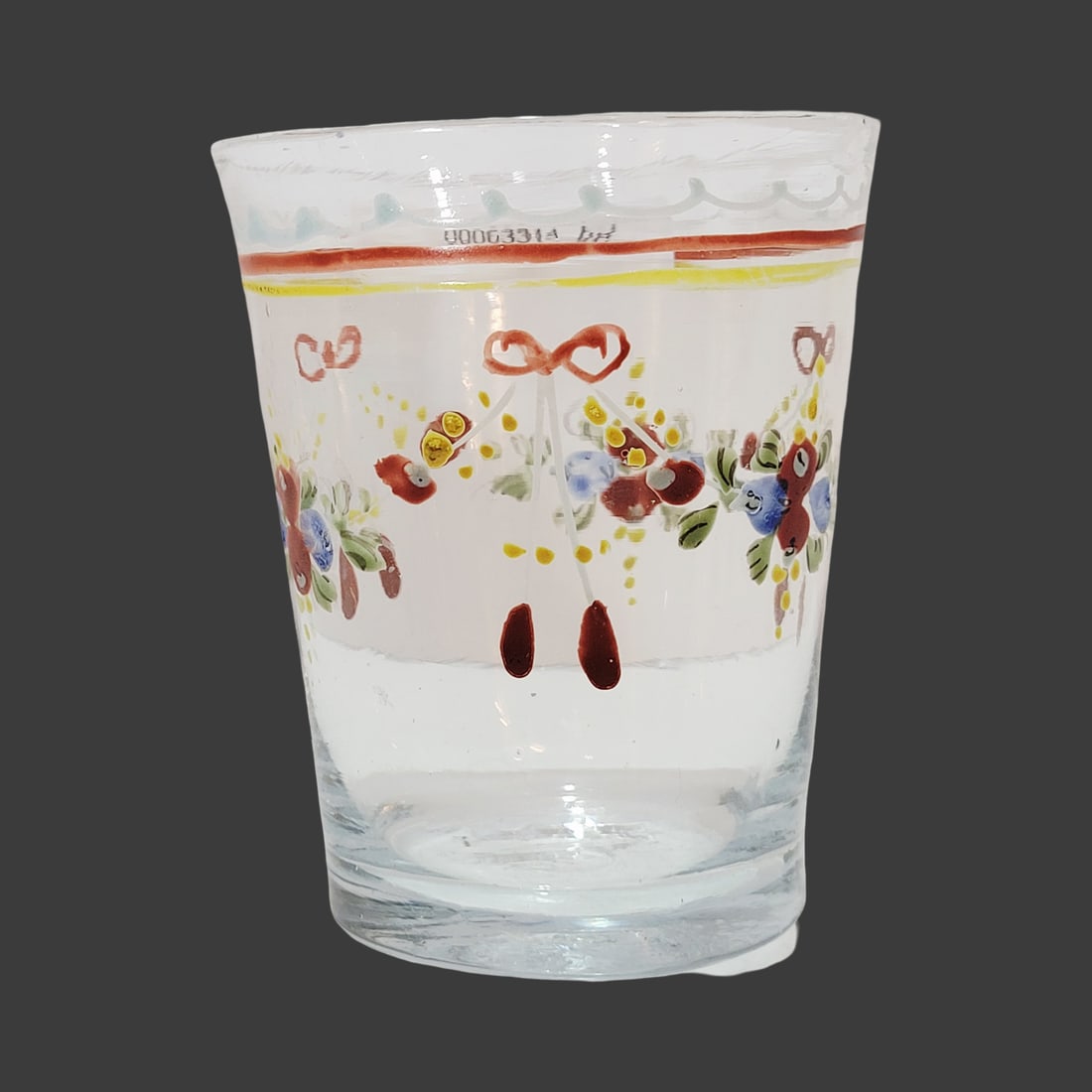 Biedermeier Period Beaker, Bohemian Beaker, Floral Bow Tie Beaker: 3 5/8" Tall by 3.0" Wide hand blown colorless glass with bubbles and impurities, hand enameled florals on tapered body, base with nice pontil, circa late 1700's