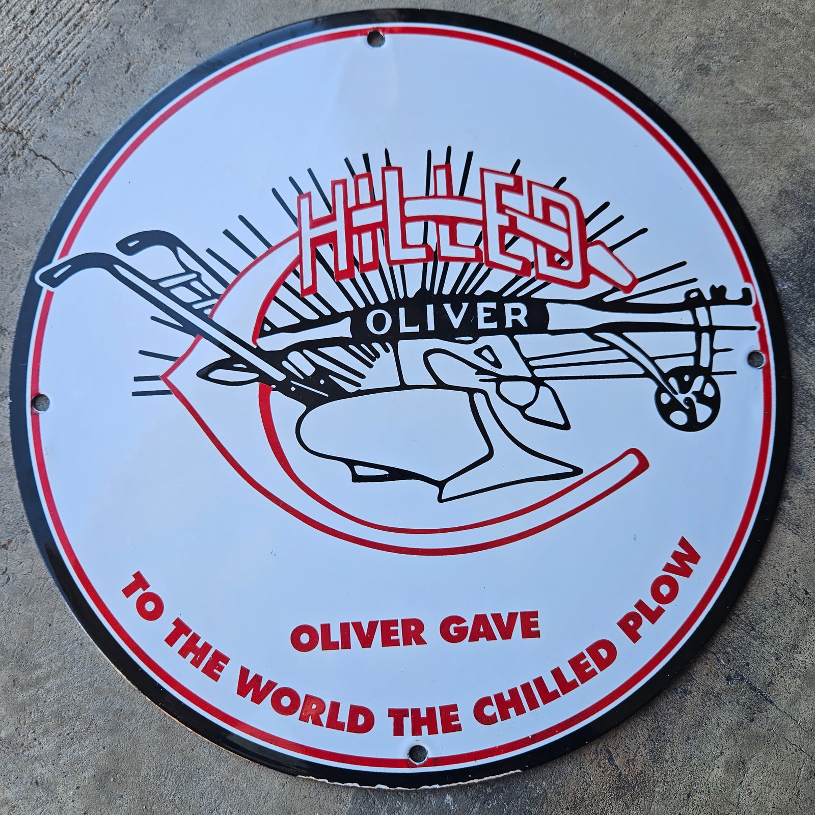 OLIVER CHILLED PLOW VINTAGE PORCELAIN SIGN - RARE AGRICULTURAL AD: This distinctive vintage porcelain sign celebrates the Oliver Chilled Plow, a revolutionary advancement in agricultural technology. Measuring 11.75 inches in diameter and weighing about 2 pounds, it b