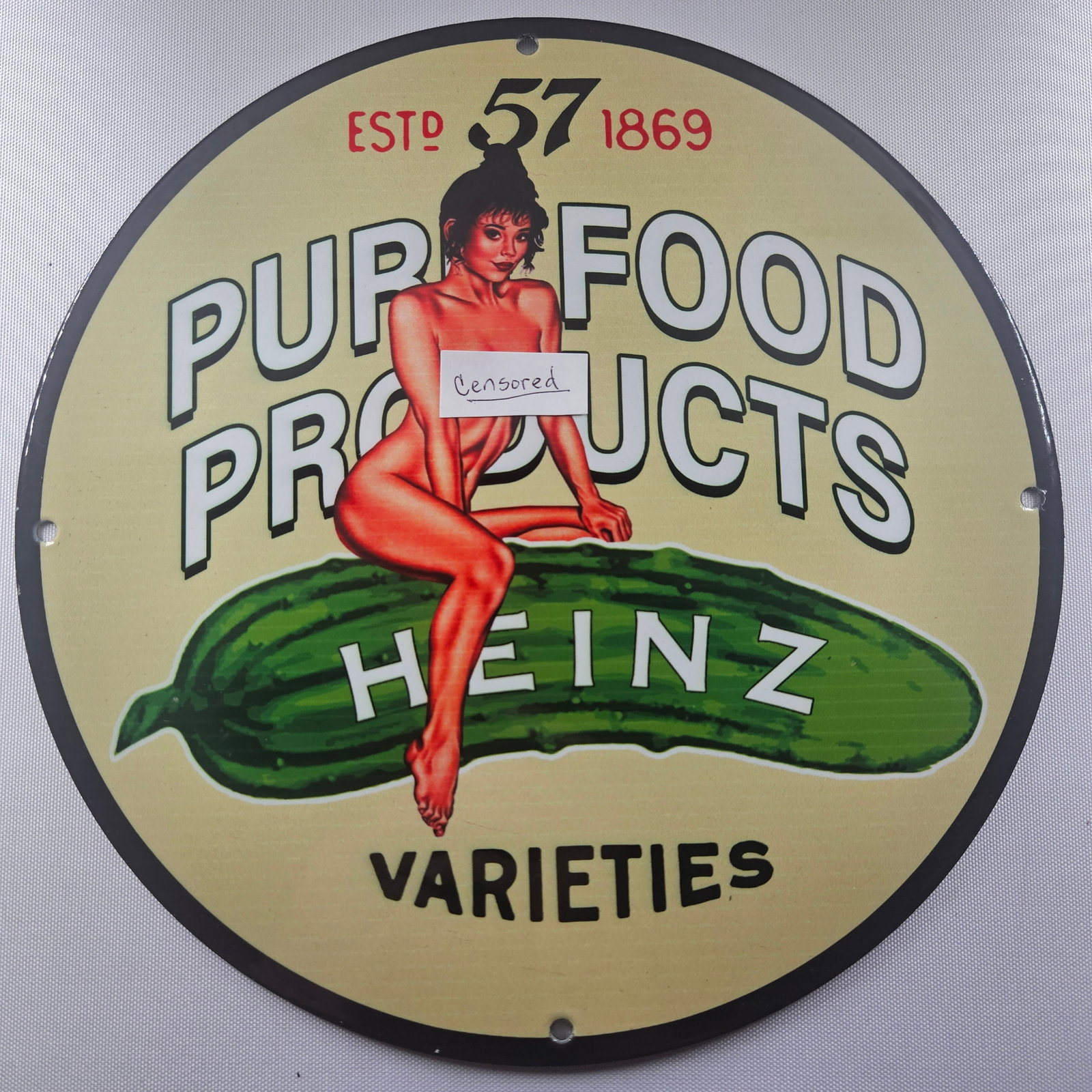 1869 Heinz Pure Food Products 12-inch Porcelain Sign: The 1869 Heinz Pure Food Products 12-inch Porcelain Sign is a captivating piece of advertisement history, showcasing the early branding of the renowned Heinz company. Measuring 12 inches in diameter, 