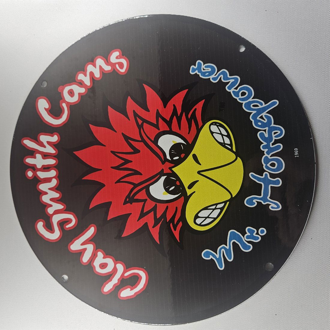 1969 Clay Smith Cams Mr. Horsepower 12-inch Porcelain Sign: The 1969 Clay Smith Cams Mr. Horsepower 12-inch Porcelain Sign is a captivating piece of advertisement history, featuring the iconic Mr. Horsepower logo synonymous with Clay Smith Cams. Measuring 12 i