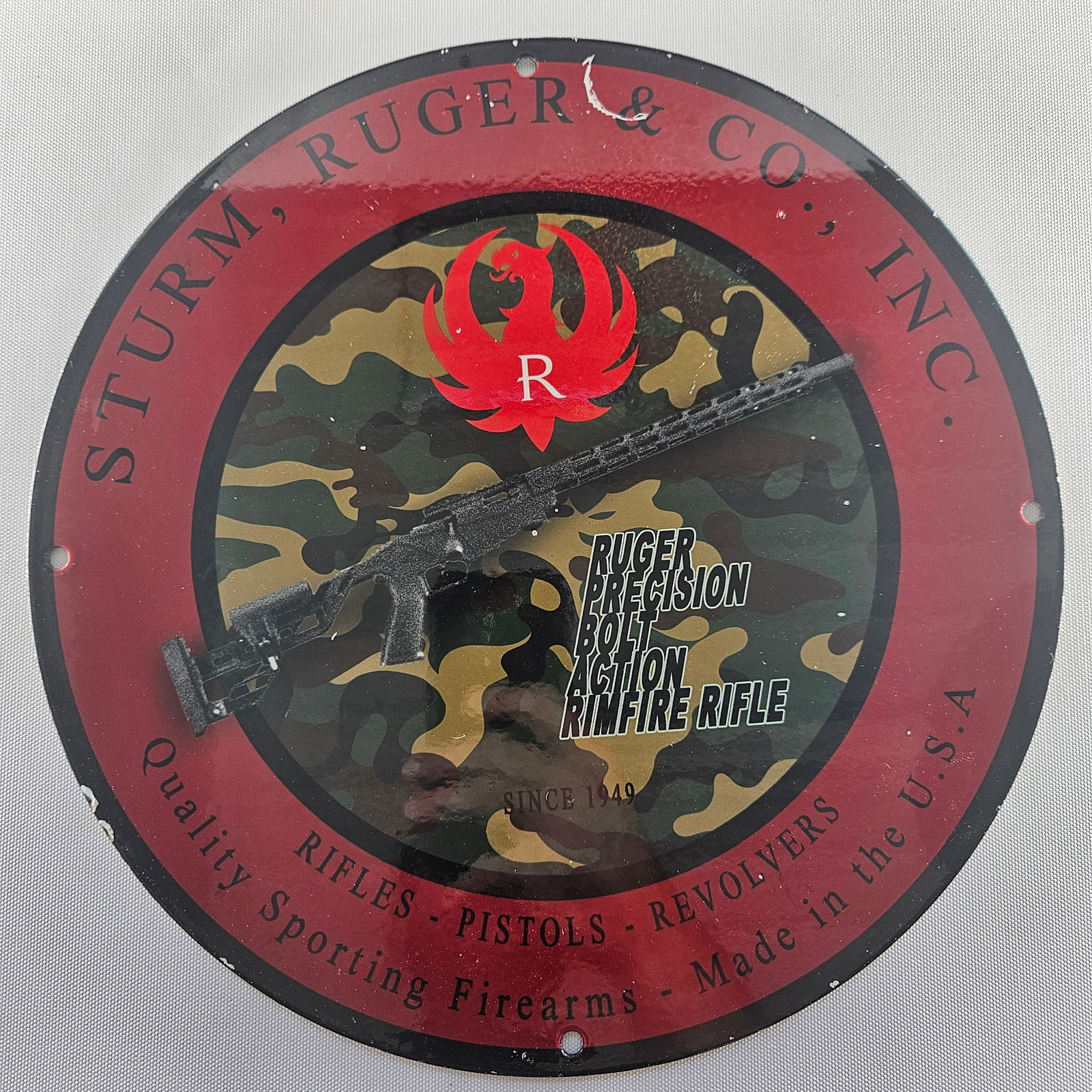 1949 STURM, RUGER & CO. FIREARMS GAS OIL GARAGE MAN CAVE PORCELAIN SIGN: Experience a piece of advertising history with this Sturm, Ruger & Co. Firearms memorabilia. Measuring approx. 12 inches, this collectible showcases the brand's early promotional efforts, reflecting t