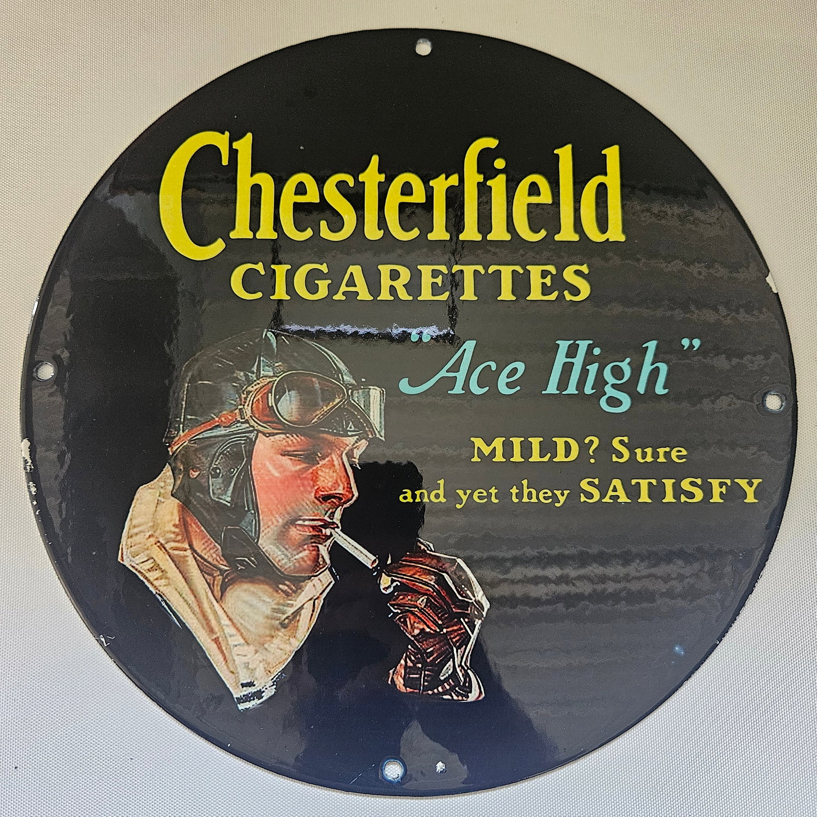 CHESTERFIELD ACE HIGH CIGARETTES GAS OIL GARAGE MAN CAVE PORCELAIN SIGN: This advertisement features the Chesterfield brand name in red and yellow lettering, with "Ace High" written below it. The text "Mild? Sure" and "and yet they Satisfy" appears below the brand name. Ch