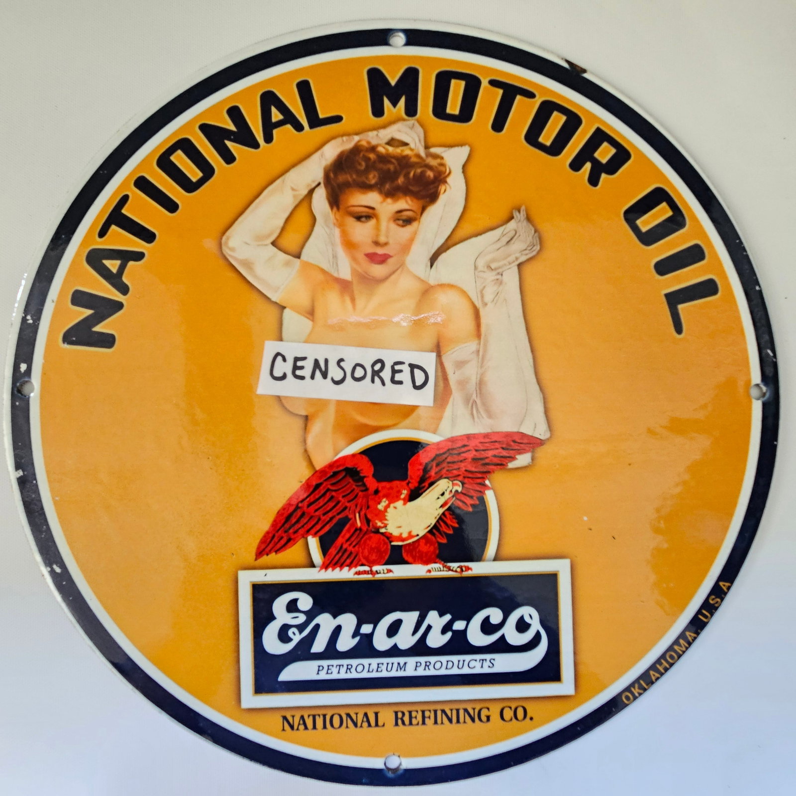 EN-AR-CO NATIONAL MOTOR OIL GAS OIL GARAGE MAN CAVE PORCELAIN SIGN: The EN-AR-CO NATIONAL MOTOR OIL sign, measuring approximately 12 inches in diameter, is a timeless piece of advertising history, capturing the essence of early 20th-century Americana. With its bold le