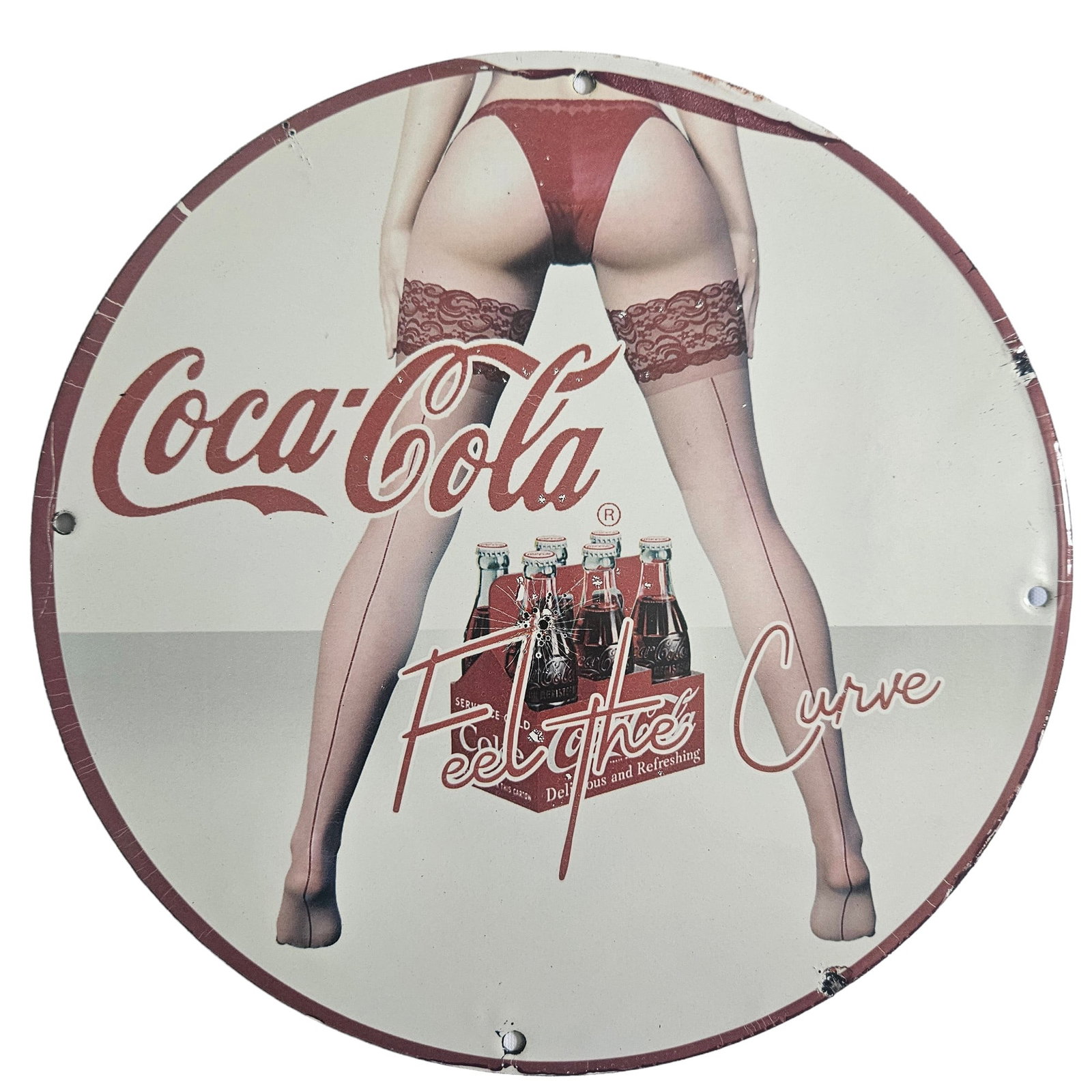 Vintage Coca-Cola "Feel the Curve" Soda POP Beverage Porcelain Advertising Sign: The Coca-Cola "Feel the Curve" Soda POP Beverage Porcelain Advertising Sign, with a diameter of about 12 inches, captures the timeless appeal of this iconic brand. Featuring the classic Coca-Cola logo