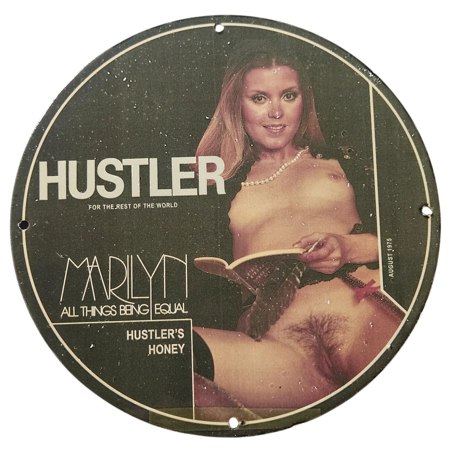 323. Rare 1975 Hustler Porcelain Sign Featuring Marilyn - Collectible Pin-Up Memorabilia: Discover an exquisite piece of vintage Americana with this rare 1975 Hustler porcelain sign featuring the iconic Marilyn from the publication Hustler. This stunning sign is not just another collectibl
