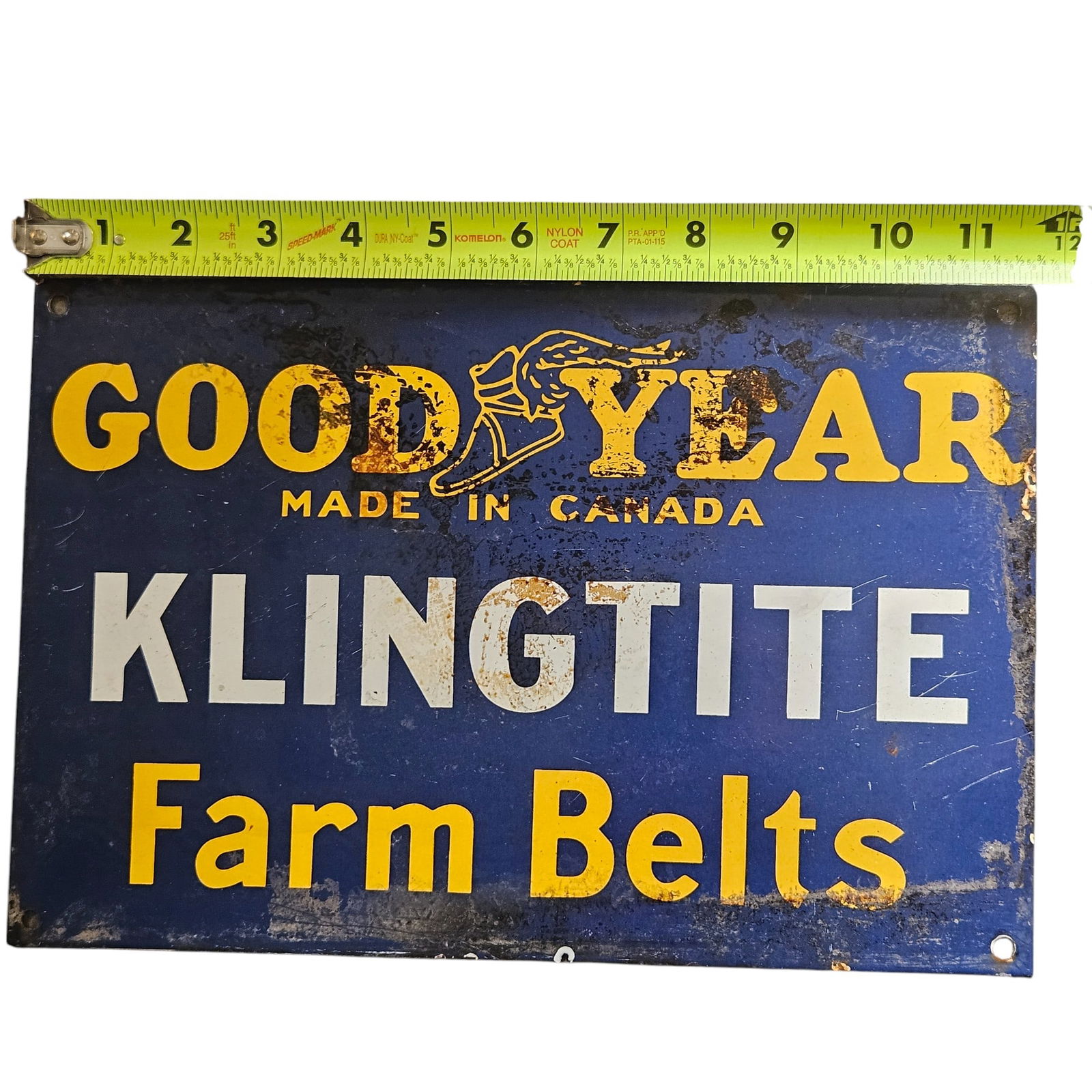 Vintage Good Year Klingtite Farm Belts Porcelain Sign ? Canadian Antique Advertising: Discover a stunning piece of agricultural history with this vintage Good Year Klingtite Farm Belts porcelain sign. Made in Canada, this colorful sign features striking yellow lettering against a rich