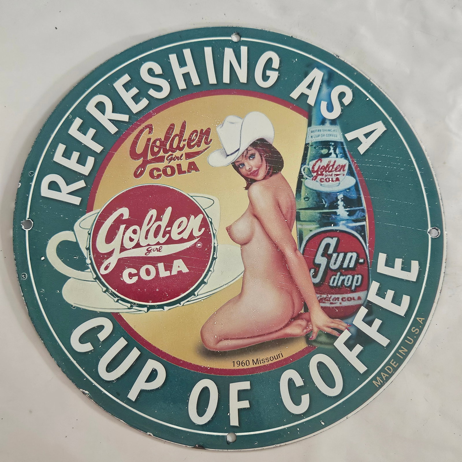 Vintage Golden Cola Porcelain Sign: Refreshing As A Cup of Coffee - Rare Collectible Art Piece: Discover the charm of mid-century advertising with this vintage porcelain sign for Golden Cola. Originally produced in 1960 in Missouri, this eye-catching piece features a whimsical design, showcasing