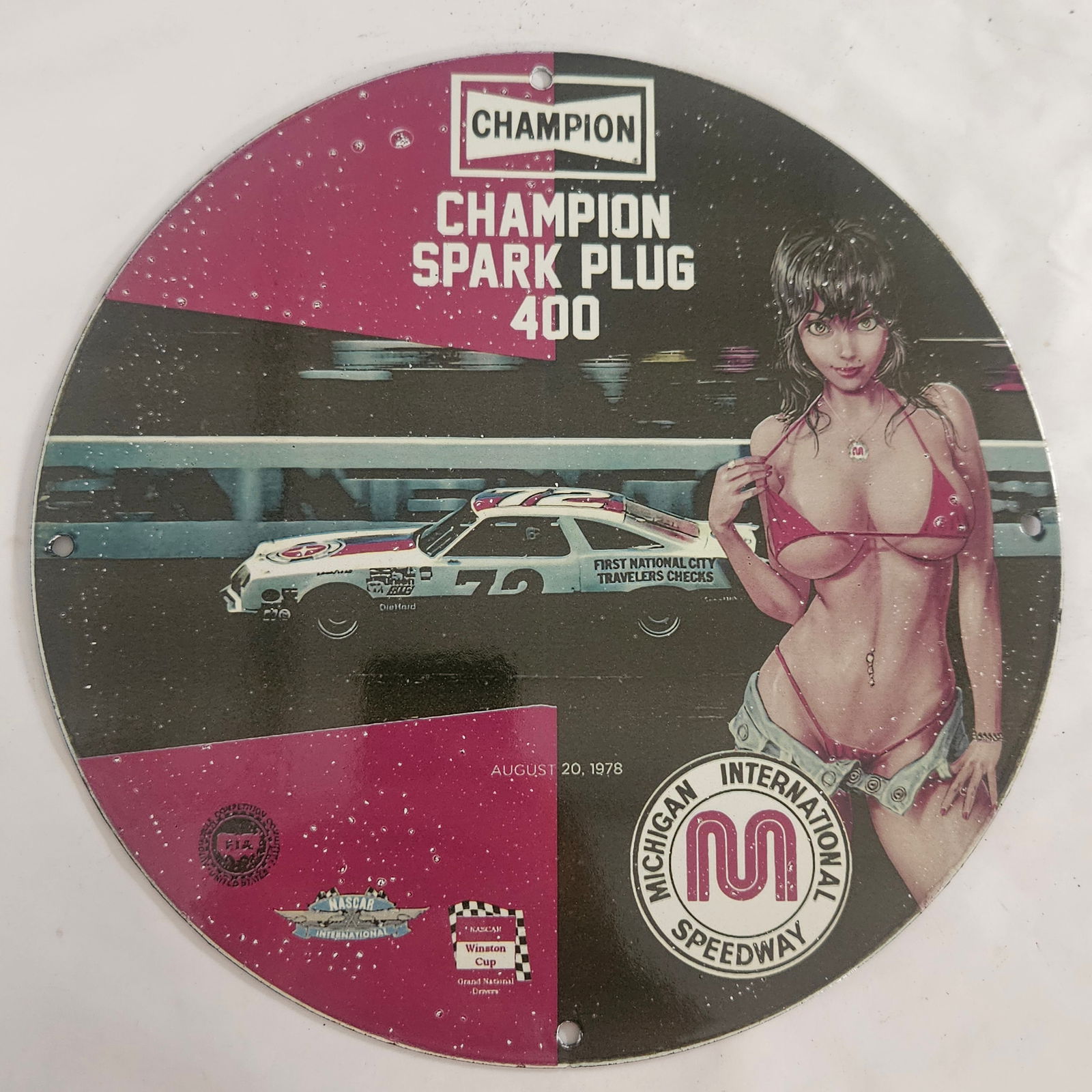 Vintage Champion Spark Plug 400 Porcelain Sign - International Speedway Collectible: This striking vintage porcelain sign, celebrating the Champion Spark Plug 400, is a must-have for any racing enthusiast, collector, or fan of nostalgic automotive memorabilia. Manufactured for the Int