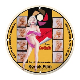 Vintage Kodak Advertising Sign Featuring Iconic Imagery and Bold Graphics