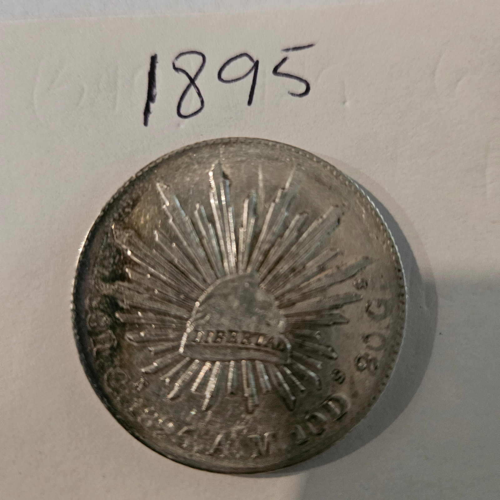 Rare 1895 Vintage Coin - Collectible Liberty Design - Bid Now!: Explore this stunning 1895 vintage coin featuring an iconic liberty design, perfect for collectors and enthusiasts alike. This piece is not just a coin; it?s a slice of history, representative of a ti