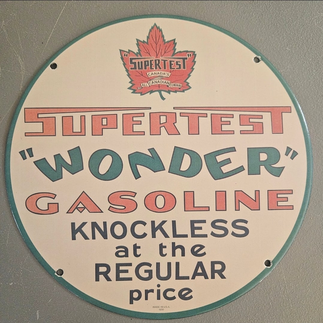 Vintage Supertst 'Wonder' Gasoline Porcelain Sign - Canadian Collectible: This vintage porcelain sign advertising Supertst 'Wonder' Gasoline is a true collector's gem, perfect for enthusiasts of retro gas station memorabilia. Featuring a round design and vibrant colors, thi