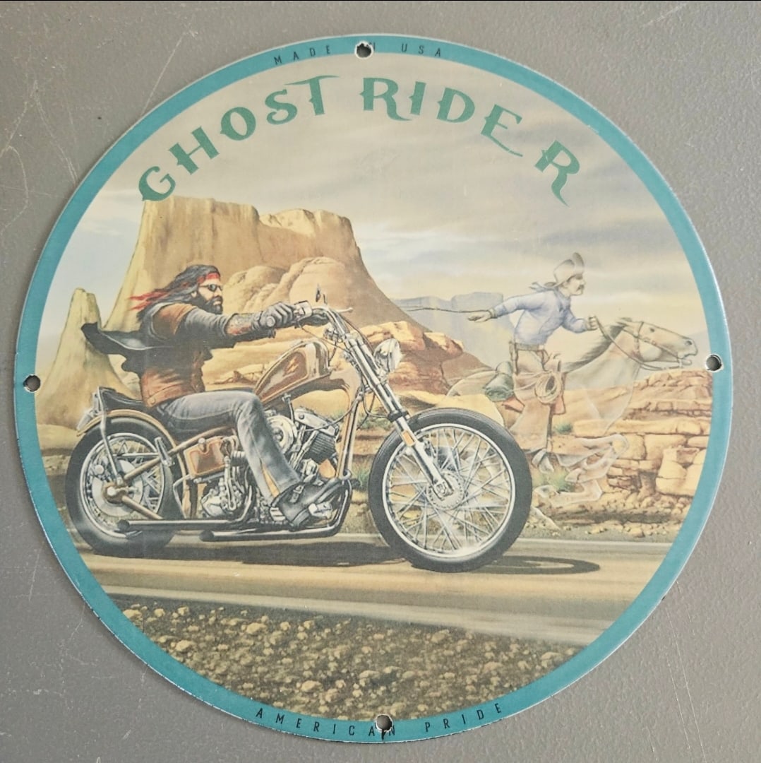 Vintage Ghost Rider Porcelain Sign - Made in USA, Motorcycle Art for Collectors: Discover the allure of American pride with this striking vintage Ghost Rider porcelain sign. Measuring in a round shape, this exquisite piece captures the spirit of the open road and the freedom of mo