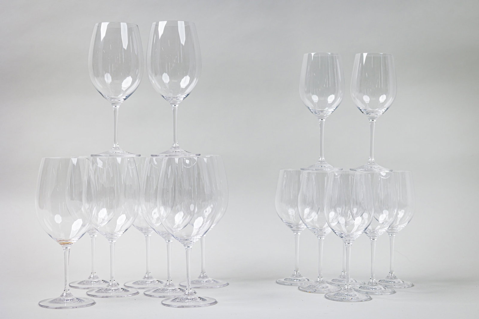 (17) Riedel Tall Wine Glasses: 21st c., Austria, taller ones are Similar to Veritas model, 7.75"h x 3.5"dia, and shorter ones are Similar to Vinum model, 8"h x 2.75"dia, marked Provenance: Property from an 875 Park Ave Penthouse