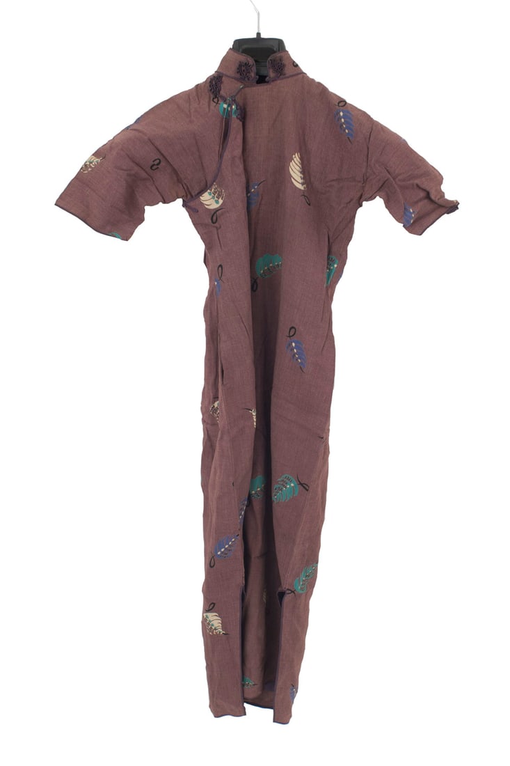 Vintage Chinese Dress: Vintage plum colored synthetic fabric small Chinese dress with long sleevese, a beige and blue leaf pattern, and a frog closure at the neckDimensions: 15"w x 15"d x 45"h