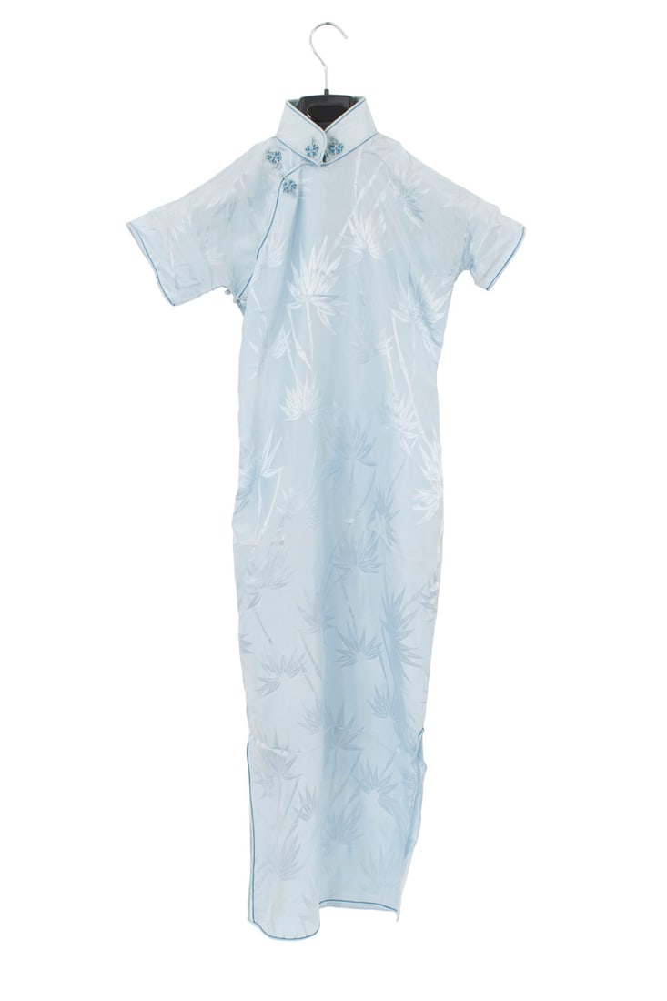 Vintage Chinese Dress: Light blue synthetic fabric small Chinese dress with short sleeves, a light bamboo design, and a frog closure at the neckDimensions: 15"w x 15"d x 46"h