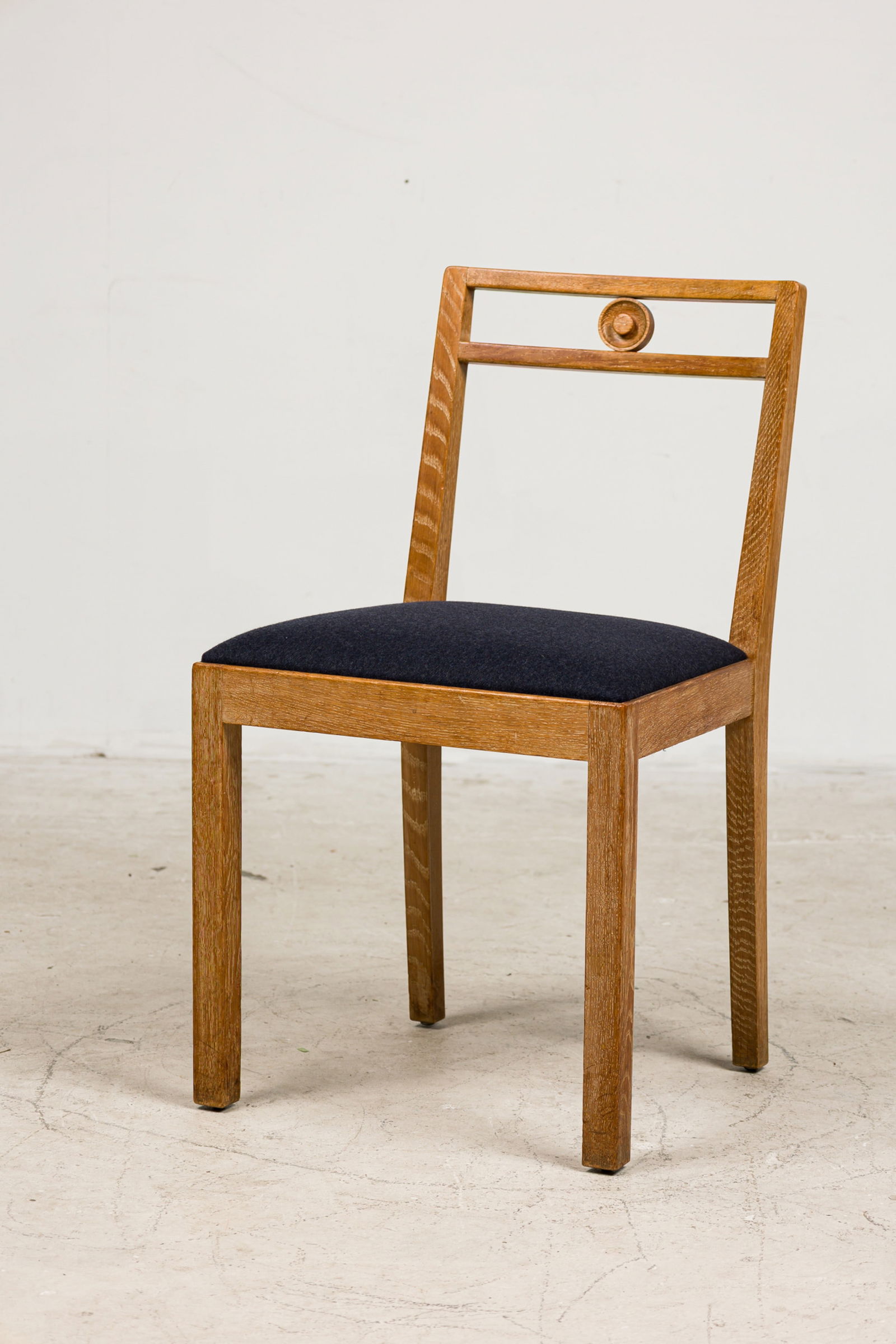 Axel Einar Hjorth, "Dagmar" Side Chair: c. 1935, Sweden, limed oak, with dark grey felt padded seat, for Nordiska Kompaniet, brass label to underside, 31"h x 18"w x 15"d, 19"h (to seat) Provenance: From a SIngle-Owner Collection of Swedish