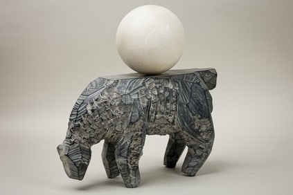 Hand-Carved Rock Sculpture With Orb