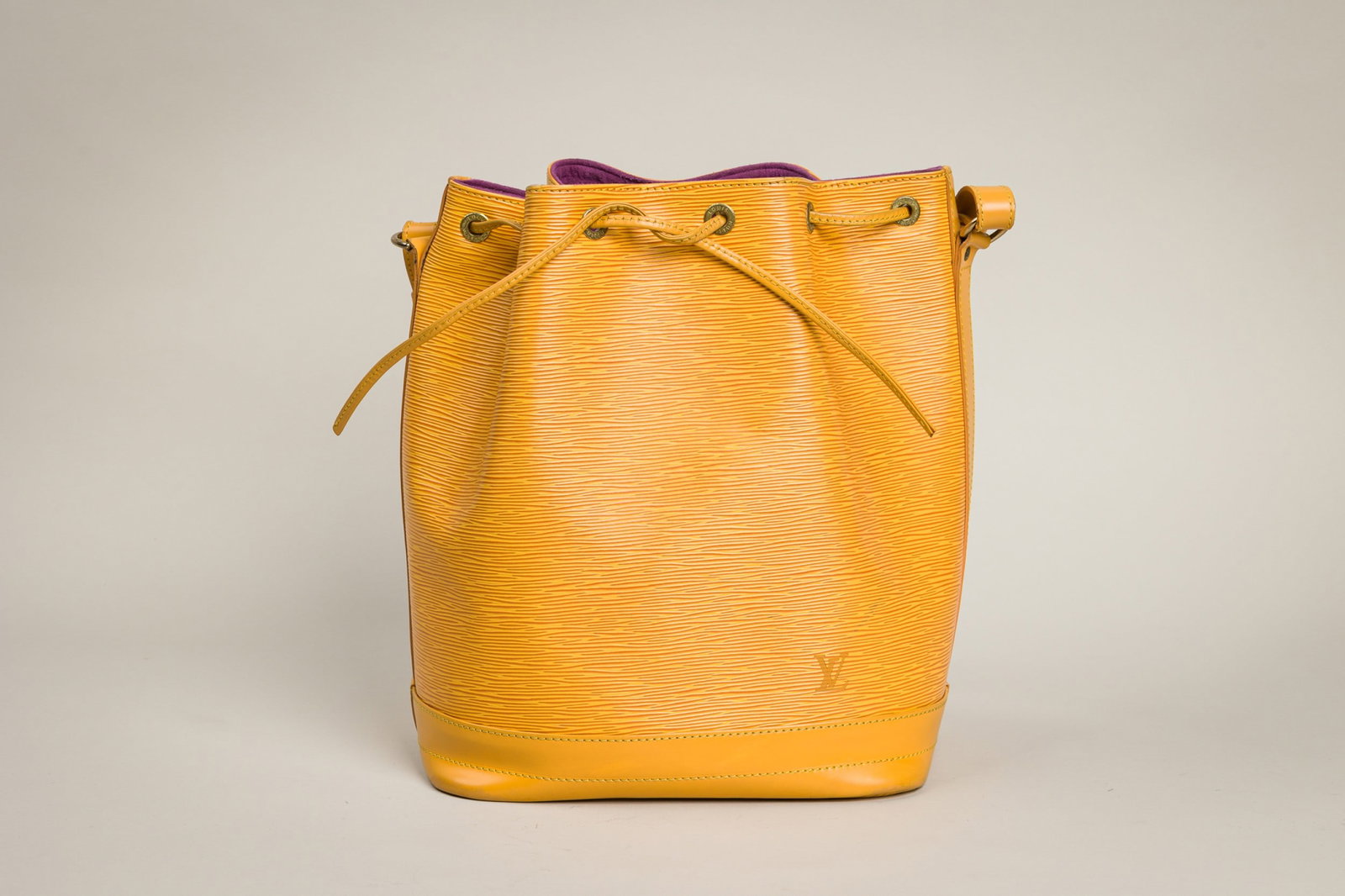 Louis Vuitton Epi Noe Shoulder Bag: Brand: Louis Vuitton Model: Noe shoulder bag Material: Epi leather with alcantara lining Reference: M44009 Color: Tassil yellow with purple lining Hardware: Gold tone Date Code: AR0944 Approx. Dimensi
