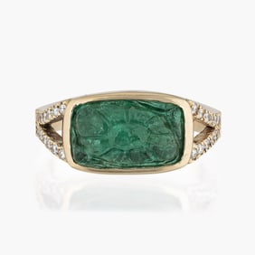 Carved emerald and diamond gold ring.