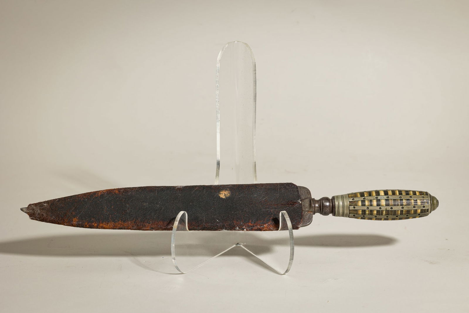 English Renaissance Engraved Marriage Knife and Sheath: Possibly 16th/17th c., England, the iron blade etched with both bawdy and domestic marriage scenes, stone and bone inlaid handle, stitched leather cover, 1.5"h x 18"l x 2.5"w Provenance