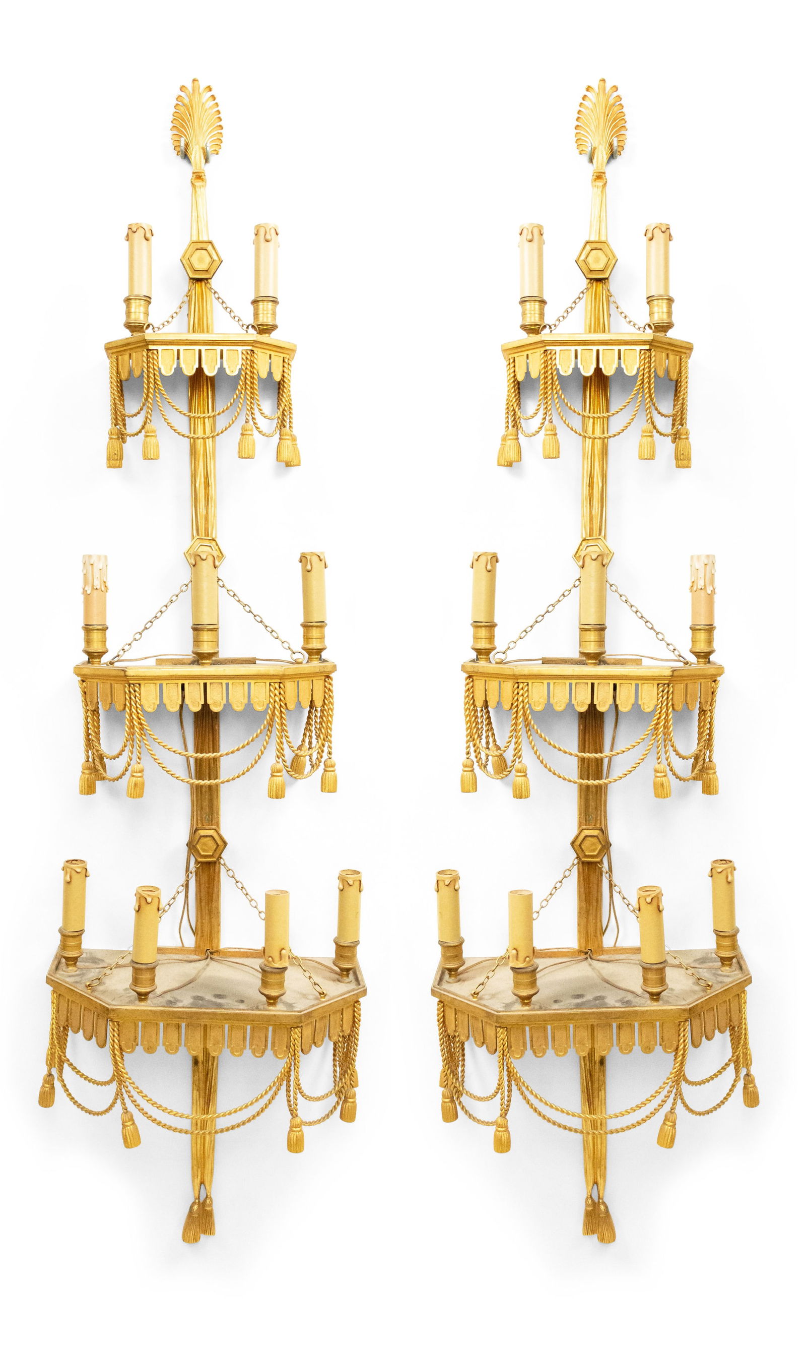 Monumental Pair French Empire Bronze Dore Wall Sconces: c. 19th/20th c., France, gilt bronze, the three platform tiers strewn with fringe and rope and tassel decoration, set with eight faux candlesticks wired with candelabra sockets, 56"h x 14"w