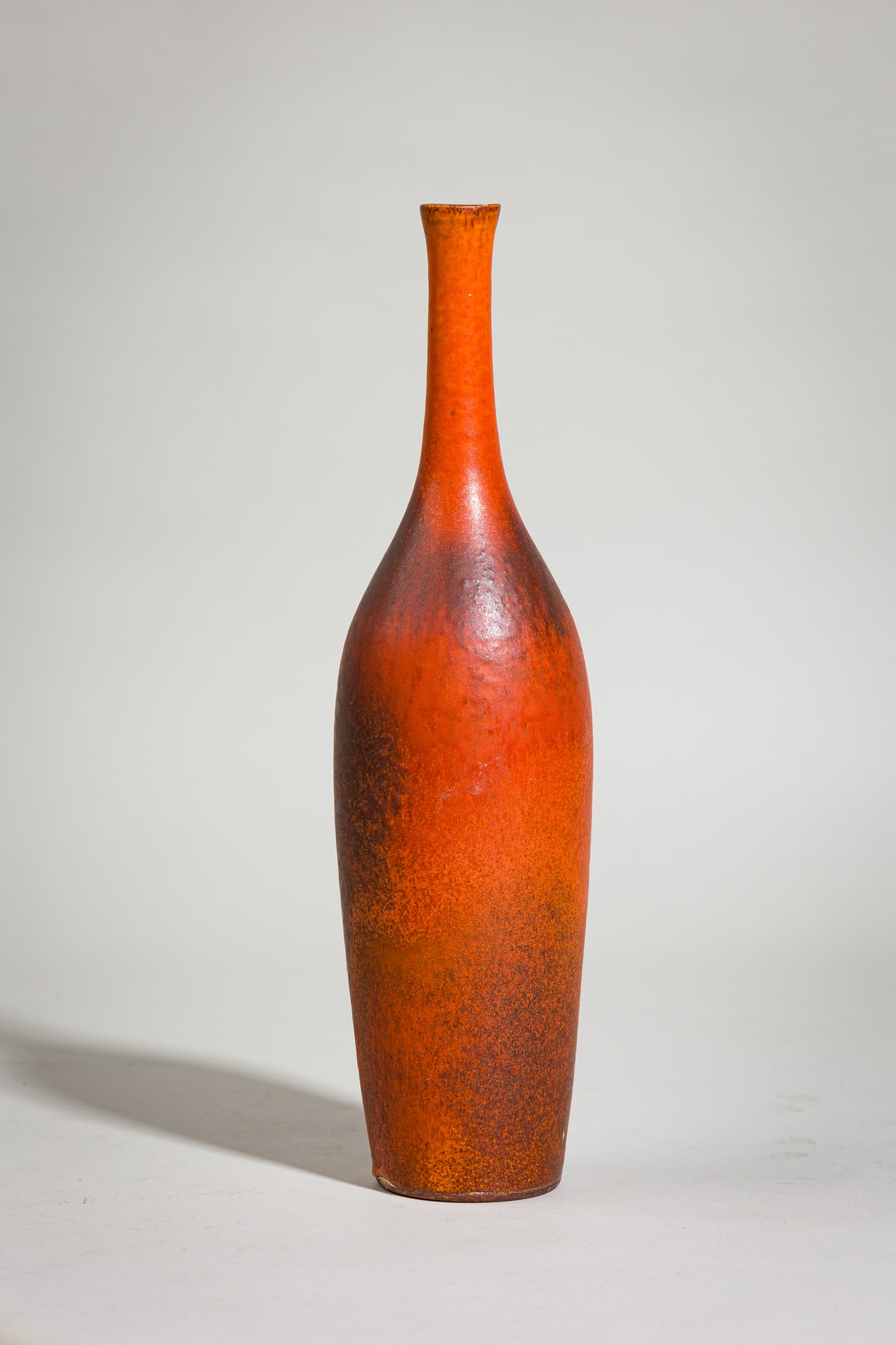 Suzanne Ramie, Orange Glazed Ceramic Bottle Vase: c. 1950, France, brown speckled orange glazed pottery, for Atelier Madoura, signed Madoura to underside, 12"h x 4"dia Provenance: 118 E. 87th St, NYC: A Private Collection featuring&nbs
